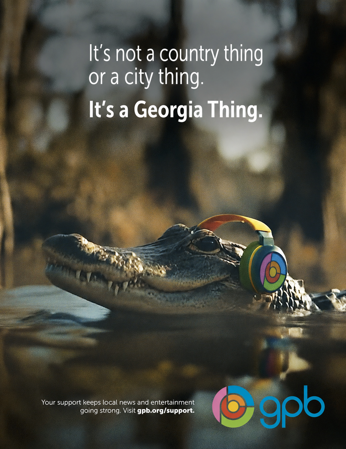 Alligator wearing colorful headphones with the slogan 'It's not a country thing or a city thing. It's a Georgia Thing.' and the GPB logo in the corner.